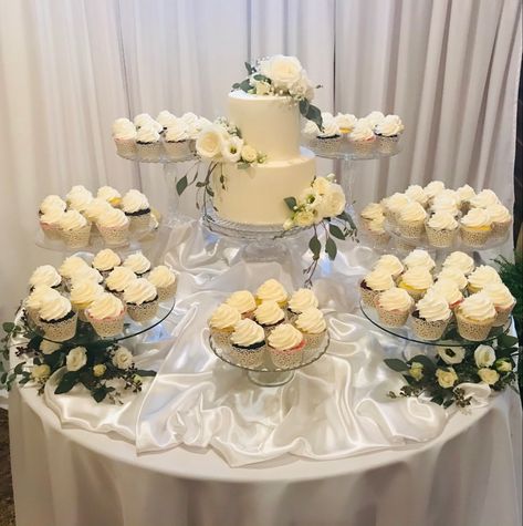 Wedding Cupcake Stands Display, Wedding Cupcake Set Up Ideas, One Tier Cake With Cupcakes, Elegant Cupcake Display, Round Wedding Cake Table, Cake And Cupcakes Display, Unique Wedding Cupcake Display, Two Tier Cake With Cupcakes, Wedding Cake Table Ideas Display Cupcake Stands