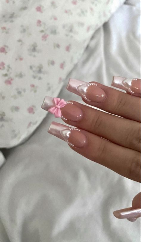 these are soft pink acrylic french nails, perfect for your aesthetic Nails With Bows Rhinestones, Pink Bow Valentines Nails, Pink Nails Ideas Coquette, Acrylic Nails Bow Charm, Pink Nails Princess, Christmas Bow Nails Acrylic, Nails W Bow Charm, Nail Inspo Coffin Charms, Light Pink Nails Y2k