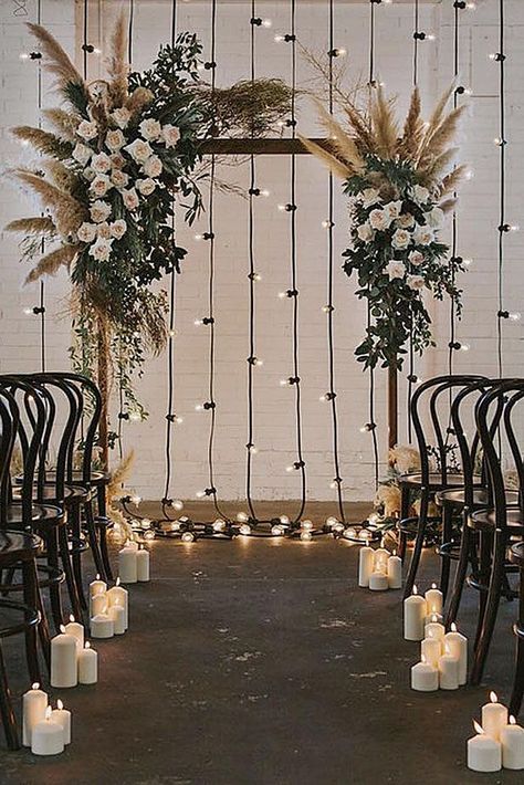 wedding backdrop ideas arch with flowers and feathers against the background of a glowing garland nouba via instagram Ceremony Space Decor, Loft Wedding Ceremony, Tulle Ideas, Ceremony Backdrop Indoor, Fall Ball, Rustic Wedding Decorations, Arch Ideas, Wedding Reception Backdrop, Diy Wedding Backdrop