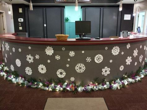 Front desk with snow flakes and garland Christmas Decorations For Nurses Station, Christmas Front Desk Decorations, Corporate Office Christmas Decor, Front Office Christmas Decor, Nurse Station Christmas Decor, Front Office Christmas Decorations, Halloween Office Decorations Front Desk, Front Desk Christmas Decorations, Reception Desk Christmas Decor