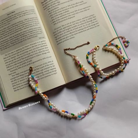 White pearl and rainbow beaded jewel set 🌈 Combo of two 170/- + shipping🦋 Shipping all over India 🎀 DM or whatsapp 9748085164✉️ [Accessory, jewellery, beaded necklace, beads, beaded Elegance, beaded accessories] #beadedjewelleryhandmade #handmadejewelry #beadedelegance #beadedaccessories #handbeaded #rainbownecklace #affordable Rainbow Beaded Pearl Necklace For Gifts, Trendy Rainbow Beaded Necklace, Rainbow Pearl Beaded Necklaces, Handmade Rainbow Beaded Choker Necklace, Rainbow Colorful Beads Pearl Necklace, Rainbow Necklace, Beaded Jewels, Rainbow Beads, Beaded Accessories