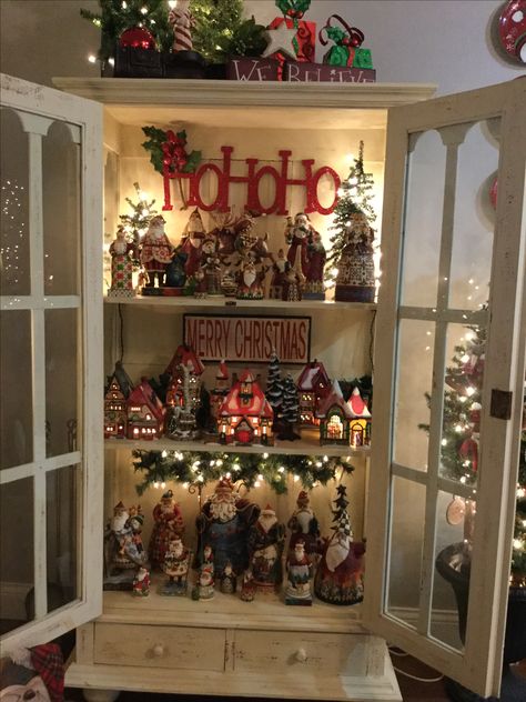 Christmas Village Display Cabinet, China Cabinet Decorated For Christmas, Display Santa Collection, Possible Dreams Santa Display, Jim Shore Christmas Display, Christmas Curio Cabinet Decor, Santa Collection Display Ideas, Santa Display Ideas, Christmas Hutch Decor