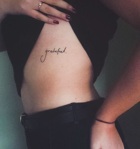 Below Bra Line Tattoo, Grateful Tattoo Fonts, Tattoo Under Bra Line, Grateful Tattoos For Women, Gratitude Tattoo For Women, Tattoos Women Quotes, Under Bra Tattoo, Side Tattoos Women Quotes, Grateful Tattoo Ideas