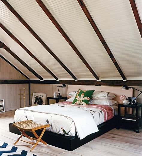 Low-slung decor makes this bedroom visually appealing Bedroom Ideas Slanted Ceiling, Rooms With Slanted Ceilings, Slanted Ceiling Bedroom, Sloped Ceiling Bedroom, Small Attic Bedroom, Slanted Walls, Attic Bedroom Designs, Slanted Ceiling, Small Attic