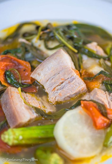 Sinigang na Baboy with Gabi is a popular Filipino soup dish. It is composed of pork and vegetables boiled in a clear sour broth. Pork Belly Soup, Sinigang Na Baboy Recipe, Filipino Soups, Poaching Chicken, Pork Sinigang, Sinigang Recipe, Philippine Recipes, Filipino Soup, Pinoy Recipe