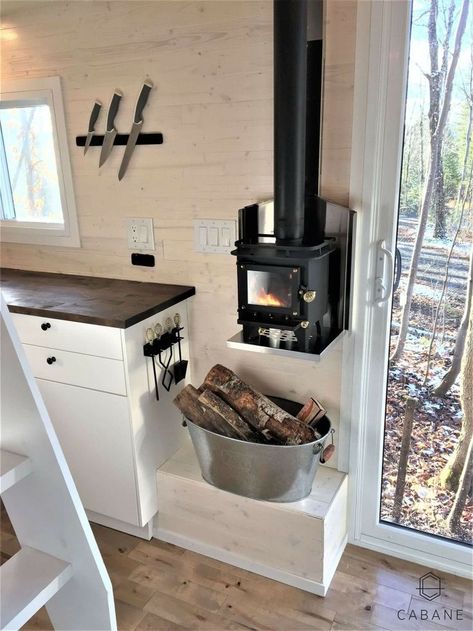 Placement and size of stove. Small Wood Burning Stove Tiny House, Wood Stove In Camper, Camper Wood Stove, Camper Living With Kids, Tiny Home Decorating Ideas, Homemade Wood Stove, Tiny Cabin Kitchen, Small Cabin Kitchens, Tiny House Interior Design Ideas