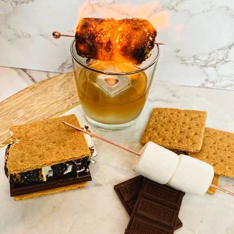 I am always looking to craft twists on classic old fashioned and with summer almost here, I want to create a s'mores bourbon drink. Call it kismet, but fellow Bourbon & Banter contributor Matt Evans also had the same idea, and thus, the Kentucky Campfire was born! Smores Bourbon Cocktail, S’more Old Fashioned, S'mores Old Fashioned, Bourbon Drinks Recipes, Bourbon Drink, Homemade Liqueur, Glass Containers With Lids, Bourbon Cocktail, Bourbon Tasting