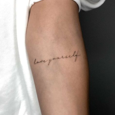 Love Yourself Quote Tattoo, Self Love Cursive Tattoo, Tattoo Quotes Self Love, Two Word Tattoos For Women, Delicate Name Tattoo, Small Tattoos Love, Love Yourself Tatuaje, Self Love Tattoo Wording, Love Yourself Tattoos For Women