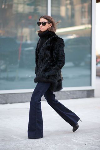 Bell bottoms faux fur turtleneck sweater glasses heels  Best New York Fashion Week Street Style Fall 2015 - NYFW Street Style Fur Coat Outfit Black, Black Fur Jacket Outfit, Black Fur Coat Outfit, Faux Fur Coat Outfit, Faux Fur Coats Outfit, Fur Jacket Outfit, Black Fur Jacket, Fur Coat Outfit, Black Fur Coat