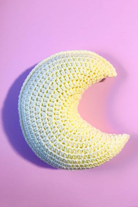 This crochet moon pillow pattern is perfect for snuggling or having on a shelf for a little extra celestial decor. Crochet Moon Pillow Pattern Free, Crochet Moon Pillow Pattern, Moon Pillow Crochet Pattern Free, Moon Pillow Crochet Pattern, Sun And Moon Crochet Pattern, Crochet Moon Pillow Free Pattern, Moon Pillow Pattern, Crochet Cloud Pillow, Crochet Moon Pillow