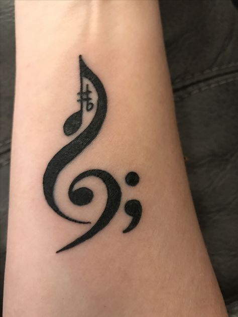 Tangled Semicolon Tattoo, Music Symbol Tattoo Design, Music Note And Semicolon Tattoo, Best Friend Semicolon Tattoo, Bass Clef Semi Colon Tattoo, Music And Semicolon Tattoo, Small Tattoos Semicolon, Music Semicolon Tattoo, Marching Band Tattoos