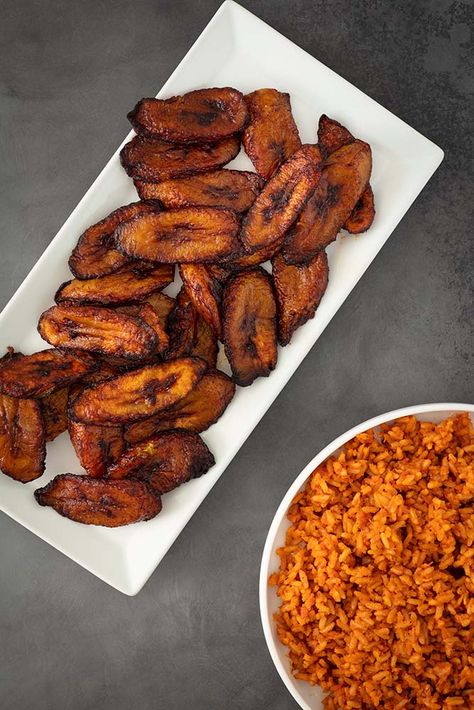 No formal gathering of Nigerian people is without this beloved staple. Those who arrive late are usually disappointed because the jollof rice and plantains are the first to disappear! Click the link for recipe Jollof Rice And Plantain, Jollof Rice Nigerian With Chicken And Plantain, Nigerian Plantain, Party Jollof Rice, Jollof Rice Nigerian, Cameroonian Food, Fried Plantain, African Recipes Nigerian Food, African Dishes