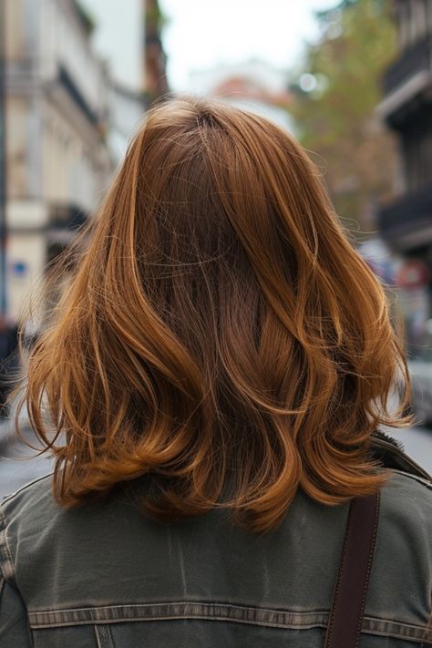 Rear view of a person with shoulder-length auburn hair on an urban street. Light Brown Orange Hair, Warm Tone Brunette, Soft Balayage Brunette, Brunette Hair Transformation, Brown Hair With Copper Highlights, Brunette Summer Hair Color, Cool Toned Brunette, Summer Brunette Hair, Burnette Hair