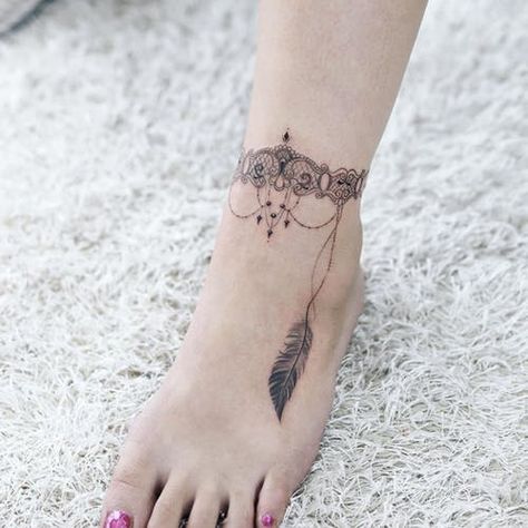 Ankle Tattoos: The Definitive Inspiration Guide | Tattoodo Ankle Tattoo Cross, Ankle Tattoo Cover Up, Feather Tattoo Ankle, Wrap Around Ankle Tattoos, Butterfly Ankle Tattoos, Ankle Band Tattoo, Ankle Tattoo Men, Ankle Tattoo Ideas, Collar Bone Tattoo For Men