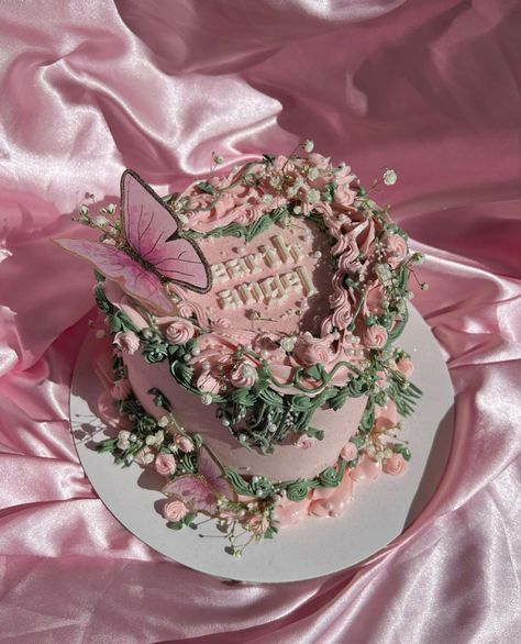 Ornate heart shaped pink and green birthday cake with a decorative pink butterfly Fairycore Cake Ideas, Gemini Fairy Cake, Ethereal Birthday Cake, Edible Flower Cake Ideas, Fairy Core Birthday Cake, Pink Fairy Birthday Cake, Fairy Cake Aesthetic, Virgo Fairy Cake, 23 Inside Her Fantasy Cake