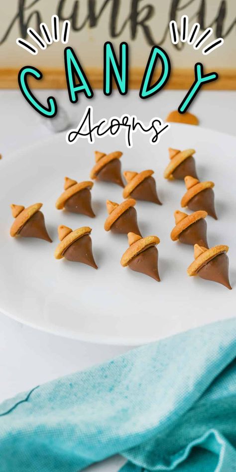 Candy Acorns are a delightful and simple treat that’s perfect for fall! Made with chocolate kisses, mini cookies, and a touch of chocolate, these bite-sized snacks resemble adorable acorns. They’re easy to make, fun to share, and add a sweet touch to any autumn gathering or Thanksgiving table. Candy Acorns Hershey's Kisses, Acorn Candy Kisses, Thanksgiving Snack For Kids To Make, Fall Candy Treats, Turkey Candy Treats, Thanksgiving Sweet Treats For Kids, Thanksgiving Candy Treats, Hershey Kiss Acorns, Thanksgiving Bark