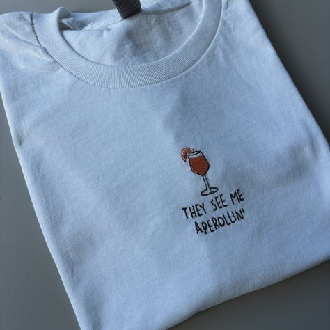 How gorgeous are these T-shirts 😭🍹 Just added them to my website! You’ll find them under core collection or search cocktail 🍸 Perfect for Summer (if we ever get one 🤣 ☀️) #embroidery #smallbusiness T Shirt Embroidery, Slogan Sweatshirt, Favourite Colour, Summer Cocktails, Embroidered Tshirt, Fashion Lighting, White Beige, Gilmore Girls, Printed Sweatshirts