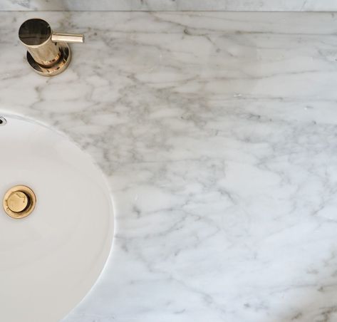 Bathroom Marble Regrets: Why we regret adding marble in 3 of our bathrooms. This is a must-read if you're considering using marble in a bath. Artwork For Marble Bathroom, Bathroom Countertops Marble, Mixing Marble In Bathroom, Carrera Marble Bathroom Countertop, Carrara Marble Tile Bathroom, Marble Counters Bathroom, Polished Marble Bathroom, Carrara Marble Bathrooms, Gray Marble Bathroom Countertop