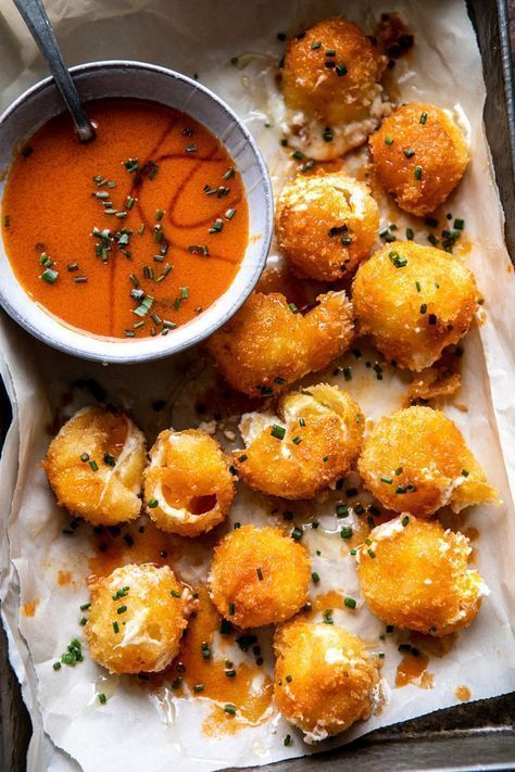 Fried Buffalo Goat Cheese Balls, soft, creamy goat cheese, rolled in Panko bread crumbs, and lightly pan fried. Golden and crisp on the outside and extra soft and melty in the center. Drizzle with spicy homemade buffalo sauce for a truly delicious appetizer that's perfect for game day and any other occasion in between. Appetizers Superbowl, Goat Cheese Balls, Fried Cheese, Homemade Buffalo Sauce, Pane Dolce, Superbowl Snacks, Cheese Balls, Half Baked, Half Baked Harvest