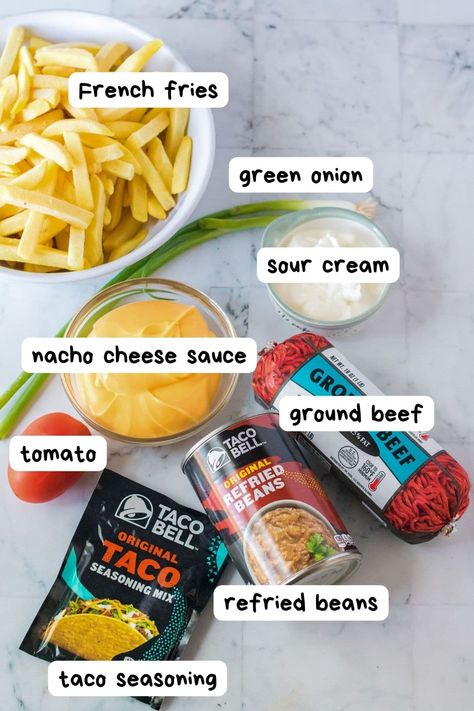 Make Taco Bell's Nacho Fries Supreme at home with this easy copycat recipe! Use fries as the base for your nachos and add ground beef, refried beans and cheese sauce. Satisfy your Taco Bell cravings at home with this easy recipe. Nacho Fries Ground Beef, Fries Supreme, Taco Bell Nacho Fries, Spicy Fries, Ground Beef Nachos, Taco Beef, Copycat Taco Bell, Beans And Cheese, Bean Nachos