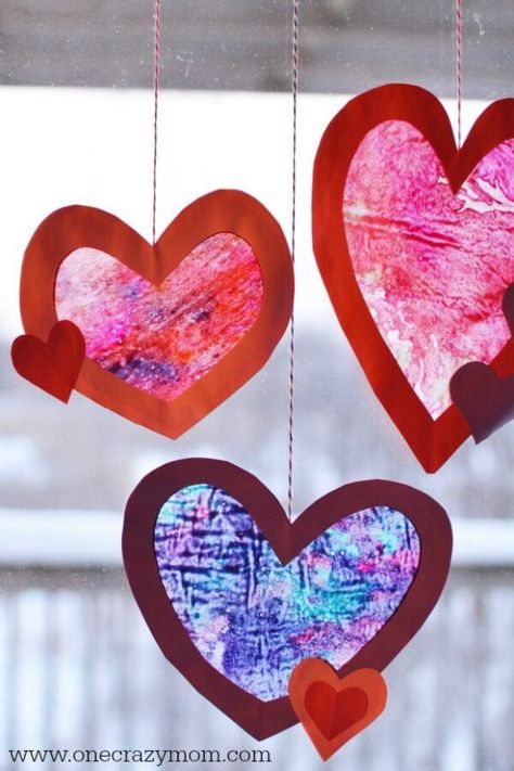 Let the kids make homemade suncatchers for the perfect Valentine's Day Craft. They will love this heart suncatcher and it's so simple to make. This Valentine’s Day craft idea is perfect for kids or adults! #onecrazymom #craftideas #valentinesdaycrafts #crafts Homemade Suncatchers, Vday Party, Heart Suncatcher, Mindfulness Art, Diy Glue, Crayon Heart, February Crafts, Easy Valentine Crafts, Valentine Craft