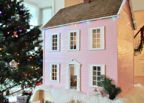 Makeover an old dollhouse for a unique DIY holiday gift idea | Building Bluebird #holiday #dollhouse #christmas Dollhouse Christmas Lights, Doll House Exterior Colors, Pink And White Dollhouse, Old Dollhouse Makeover, Doll House Redo, Melissa And Doug Dollhouse Makeover, Upcycle Dollhouse, Dollhouse Refurbish, Christmas Dollhouse Diy