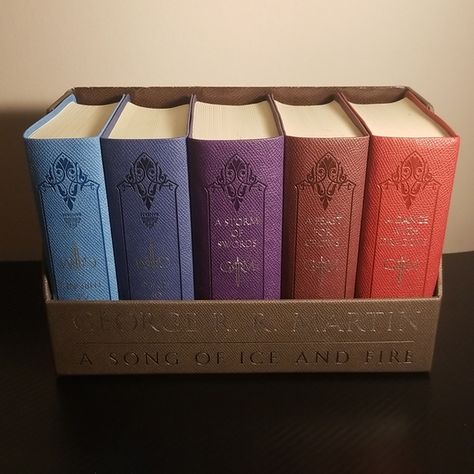 Leather back Game of Thrones book collection Game Of Thrones Book Series, Game Of Thrones Books Aesthetic, Game Of Thrones Book Cover, Game Of Thorns, Game Of Thrones Collection, Shelf Aesthetic, Bookworm Things, The Way Of Kings, Genre Of Books