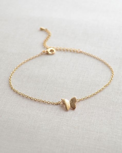 This butterfly bracelet is so dainty and feminine. It is adjustable from 7 - 9 inches, so it will fit any size wrist. The small butterfly charm measures approximately 1/2 inch. Currently only availabl Grunge Necklace, Butterfly Charm Bracelet, Butterfly Bracelet, Fancy Jewellery, Gold Earrings Designs, Dainty Bracelets, Hand Jewelry, Girly Jewelry, Stylish Jewelry