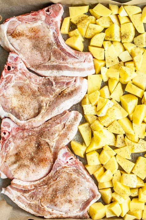 These thick, juicy, tender Pork Chops are seasoned to perfection then baked in the oven together with potatoes to create a simple but delicious dinner! #porkchops Sheet Pan Bone In Pork Chops, Pork Chops And Potatoes Skillet, Roasted Pork Chops And Potatoes, Pork Chops In The Oven With Potatoes, One Pan Pork Chops And Potatoes, Baked Pork Chops And Potatoes In Oven, Pork Chop And Potatoes In Oven, Pork Chops And Potatoes In Oven, Baked Pork Chops And Potatoes