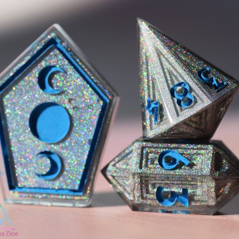 Holographic Bismuth set, this set has quite a few unusual dice shapes for me, including a crystal D8 and D12! My bismuth dice masters came from @themightyforge ! #bismuth #bismuthcrystals #bismuthdice #intricate #intricatedice #handmade #handmadedice #dicecollection #diceporn #crystaldice #crystald10 #novelty #uniquedice #ukdice #diceartist #artisan #criticalmissdice Crystal Dice, Resin Dice, Top Games, Tabletop Games, Table Top, Crystals