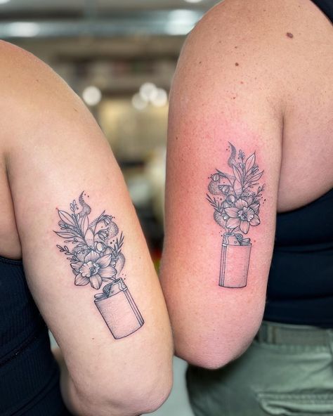 Check out these adorable matching tattoos of blooming flowers cleverly sprouting from lighters! Did you notice the lighters immediately? A perfect symbol of friendship, lighting up each other's lives. Such a sweet and meaningful way to celebrate best friends forever! @kaur_daljeett, you really nailed it with this one! 🌼💕 ⁠ Matching Tattoos For Best Friends American Traditional, Matching Lighter Tattoos, Lighter With Flowers Tattoo, Matching Floral Tattoos, Lighter Tattoo, Illustrative Tattoos, Mama Tried, Light Tattoo, Floral Tattoos