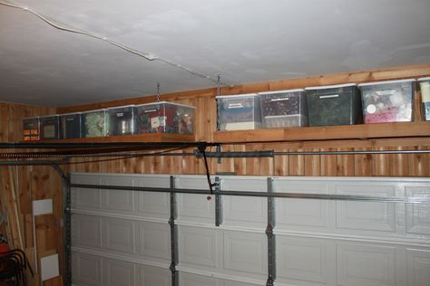 Extra storage above the garage door | The Cavender Diary Garage Door Storage, Over Garage Door, Garage Organization Shelves, Garage Storage Plans, Garage Wall Shelving, Garage Organization Systems, Garage Organization Ideas, Garage Organisation, Garage Update