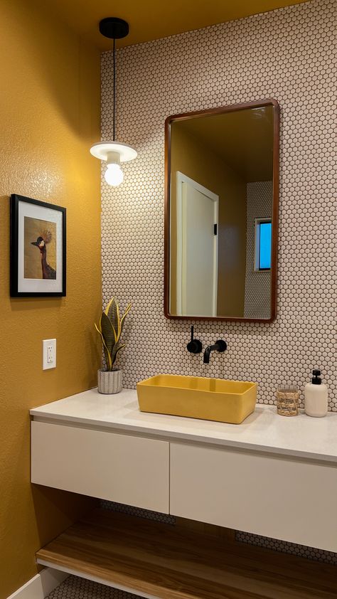 warm and moody ochre bathroom design with yellow ceiling, floating vanity, white penny tile and concrete sinks Black White Mustard Bathroom, Neutral Bathroom Pop Of Color, Yellow Tiled Bathrooms Ideas, Yellow And White Bathroom Decor, Mustard Yellow Bathroom Vanity, Yellow Ceiling Bathroom, Mustard And Grey Bathroom, Terrazo Bathroom Counter, Mustard Yellow Ceiling