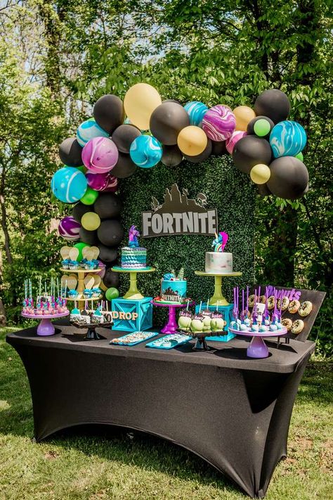 Take a look at this awesome Fortnite Birthday Party! The dessert table and balloon garland are incredible! Love the colors! See more party ideas and share yours at CatchMyParty.com #catchmyparty #partyideas #fortniteparty #fortnitedesserttable #fortniteballoongarland Fortnite Birthday Party Ideas, Fortnite Birthday Party, Video Games Birthday Party, Fortnite Birthday, Boy Birthday Party Themes, Fortnite Battle Royale, 9th Birthday Parties, 10th Birthday Parties, Birthday Party Planning