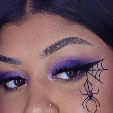 Becca🥂 on Instagram: "fun fact: ants can be spiders in disguise 😘💜🖤🕷️🕸️ Products: @rarebeauty Brow Gel & Brow Pencil in " Deep Brown " @rarebeauty Tinted Moisturizer @toofaced Sculpting Concealer " Natural Beige " @rarebeauty Bronzer Stick @onesize Setting Powder @rarebeauty Liquid Blush " Faith " @blendbunnycosmetics Blends Palette @sigmabeauty Black Eyeliner @mehronmakeup Paradise Face paint Palette @maccosmetics Lip Glass @juviasplace Lashes " Nefertiti " - - - - - - - #makeup #mak Easy Face Paint Costume Ideas, Black Widow Face Paint, Spider Web Face Painting, Spider On Eye Makeup, Easy Work Halloween Makeup, Halloween Witch Makeup Ideas Purple, Spiderweb Face Makeup, Spider Makeup Ideas, Spider Web Eyeliner Tutorial