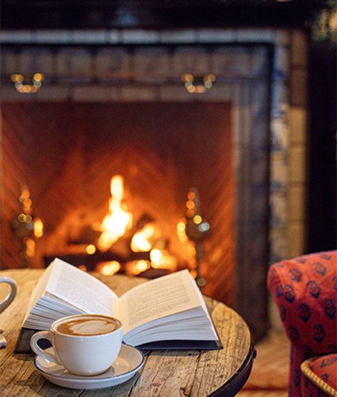 Winter Hotel Aesthetic, Sag Harbor Aesthetic, Fireplace Photoshoot, Fireplace Aesthetic, Winter Hotel, Fireplace Photography, Black Mantle, Hotel Christmas, Winter Fireplace