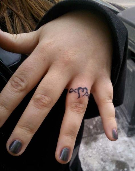 Heart With Infinity Ring Tatto is listed (or ranked) 8 on the list Ring Tattoo Ideas Finger Ring Tattoo, Celtic Ring Tattoo, Heart Ring Tattoo, Infinity Ring Tattoo, Ring Tattoo Ideas, Tattoo Designs Unique, Finger Tattoos For Couples, Ring Tattoo Designs, Wedding Band Tattoo