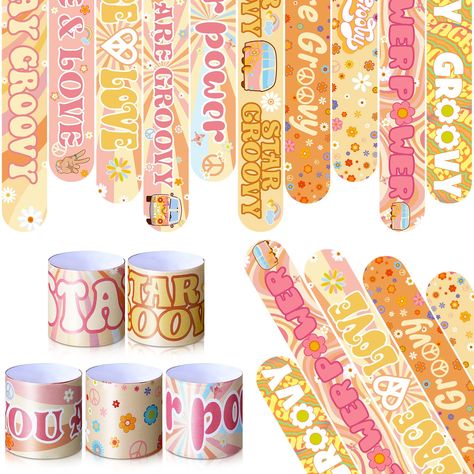 PRICES MAY VARY. Groovy Party Decorations: 40 pieces of groovy slap bracelets in 10 designs, tightly wrapped with soft faux leather type material on the outside, enough to meet your groovy birthday party needs Boho Rainbow Party Design: the boho rainbow slap bracelets are designed for groovy birthday parties, including hippie car, daisy, boho rainbow, peace wreath, printed with [peace and love], [you are groovy], [flower power], [star groovy], [groovy words], inspirational and attractive; Nice t Groovy Party Decorations, Two Groovy Party, Rainbow Snap, Boho Rainbow Birthday Party, Hippie Birthday Party, Bracelets Rainbow, Baby First Birthday Themes, Two Groovy, Groovy Party