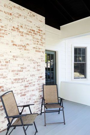 Instead of shelling out big bucks to repair a worn-down brick exterior, consider an affordable DIY upgrade with Old World charm: applying German smear. German Smear Brick, German Schmear, German Smear, Black Shutters, White Wash Brick, Brick Backsplash, Home Remodeling Diy, Brick Exterior, Brick Exterior House