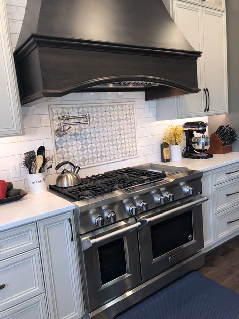 Taupe cabinets, dark wood range hood, oversized carerra subway tiles, pot filler, 48 inch range 48" Range Hood, 48 Inch Oven Range With Hood, 48 Inch Gas Range In Kitchen, 48 Inch Stove Kitchen, 48 Inch Stove With Hood, 48 Inch Range Kitchens, Kitchen With 48 Inch Range, 48 Inch Stove, 48” Range Hood