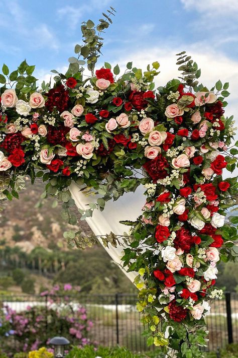 That gorgeous wedding arch could be absolutely stunning for your wedding. I love this idea for making a statement. Keep it to your wedding inspiration. Red And Blush Wedding Flowers, Red Blush White Wedding, Crimson Red And White Wedding, Red Pink And White Wedding Flowers, Red Blush Gold Wedding, Burgundy And Red Wedding, Red White Blush Wedding Flowers, Rose Garden Theme Wedding, Red Pink White Green Wedding