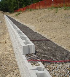 5 Tips for an Everlasting Block Retaining Wall | CornerStone Wall Solutions Block Retaining Wall, Diy Retaining Wall, Backyard Retaining Walls, Retaining Wall Block, Sloped Backyard Landscaping, Retaining Wall Design, Retaining Wall Blocks, Building A Retaining Wall, Garden Retaining Wall