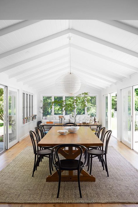 A city dweller creates a sprawling country manor in the Southern Highlands | Home Beautiful Small Country Homes, Pitched Ceiling, Timber Dining Table, Country Manor, Timber Table, Fabric Pendant, Long Dining Table, Timber Beams, Outdoor Living Design