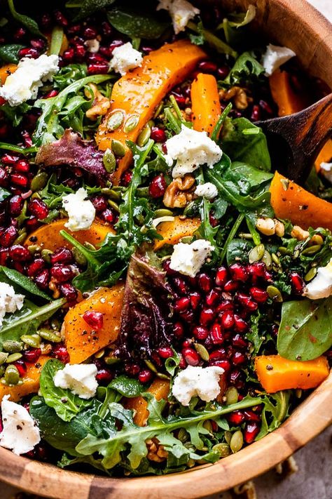 This easy Roasted Butternut Squash Salad is a nutritious and flavorful salad made with goat cheese, pomegranate arils, walnuts and more! It's all drizzled with a delicious pomegranate and apple cider vinegar dressing. Roasted Butternut Salad, Roasted Grape Salad, Pumpkin Pomegranate Salad, Butternut Salad Roasted, Pomegranate Goat Cheese Salad, Beet Butternut Squash Goat Cheese Salad, Fall Salad With Pomegranate Seeds, Fall Harvest Roasted Butternut Squash And Pomegranate Salad, Butternut Squash Goat Cheese Salad