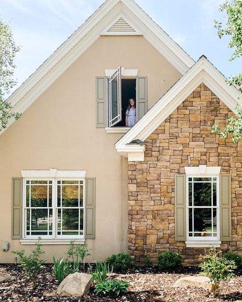 The Exterior of Our Home, Today - Chris Loves Julia Modern Cottage Exterior, Stone House Exterior, Living In A Hotel, Tudor Homes, Stone Cabin, Stone Exterior Houses, Custom Garage Doors, Dark Paint Colors, Cottage Exterior