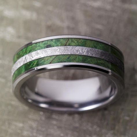 This meteorite ring has two inlays of green box elder burl flanking the gibeon meteorite center. Polished and tough tungsten makes up the sleeve of this unisex wedding band.This wood ring comes with FREE Ring Armor Waterproofing (a $75 value).RING LAYOUT - Tungsten Wedding Band for Man with Green Box Elder Burl and Meteorite Ring-3956 Ring Width: 8 mm Ring Sleeve: Tungsten Ring Profile: Beveled Ring Finish: Polished1 mm Tungsten 2 mm Green Box Elder Burl 2 mm Gibeon Meteorite 2 mm Green Box Elde Wedding Ring Emerald Green, Male Engagement Ring Green, Men’s Green Wedding Ring, Mens Green Wedding Bands, Emerald Mens Wedding Band, Green Wedding Rings For Men, Beveled Ring, Green Wedding Band, Unique Mens Wedding Bands