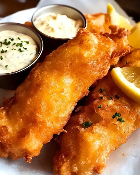 This crispy beer battered fish is the perfect combination of light, fluffy batter and tender white fish, making it an irresistible meal for any seafood lover. The beer adds a subtle depth of flavor while the high heat frying ensures a perfectly crispy coating every time. Paired with tangy tartar sauce and fresh lemon wedges, it’s a comforting dish that evokes the best of pub food classics. Battered Fish No Beer, Fish Chips Recipes Beer Batter, Beer Batter Fish And Chips, Beer Batter For Fish Deep Frying, Batter Fried Fish, Authentic Fish And Chips Recipe, Light Batter For Fish, Fish Taco Batter, Deep Fried Fish Batter