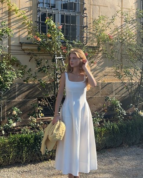 Golden hour glow and effortless charm✨ @lisa_rodina effortlessly shines in our white Square-Neck Midi Dress, paired with the soft yellow Round Neck Knitted Cardigan. 🌞A perfect look for soaking up the sun with style! 🌼Light, airy, and comfortable, this duo is made for those warm afternoon rays and a touch of elegance. #vicy #vicystudio #falloutfits #ootd #fashionstyle #elegance #dailywear #casualstyle #instastyle #authentic #fashiongram #pinterestaesthetic #pinterestinspired #whitedress Midi Dress With Cardigan, Winter Cardigan, Soft Yellow, Cardigan Shirt, New Chinese Style, White Square, Tops Fall, Knitted Cardigan, Dress With Cardigan