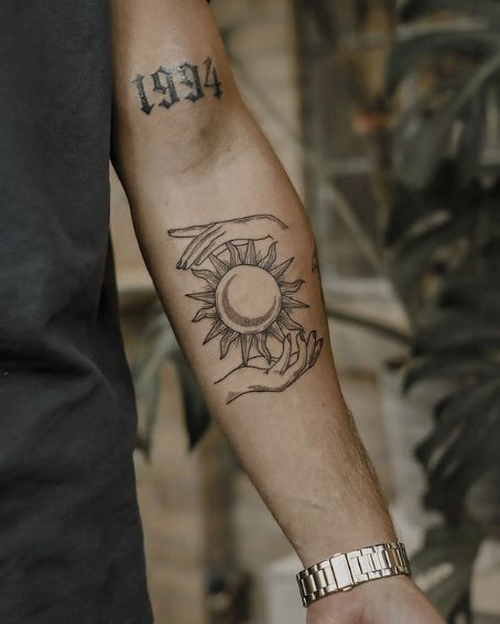 15 Amazing Sun Tattoo Designs with Meanings Sun Tattoo Chest For Men, Sun Tattoo Men Arm, Sun Men Tattoo, Inner Elbow Sun Tattoo, Men’s Sun Tattoo, Under The Elbow Tattoo, Mens Sun Tattoo, Men S Forearm Tattoo, Men’s Forarm Tattoos