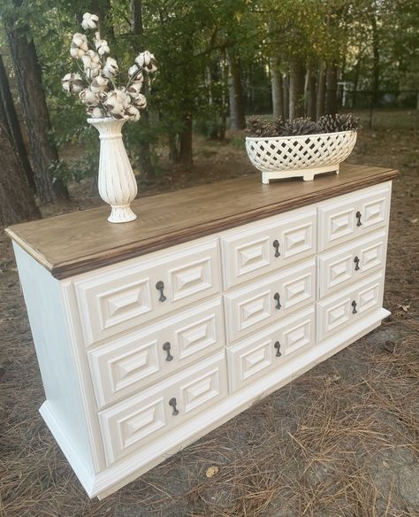 SOLD! Please use for custom order only! This gorgeous 9 Drawer Dresser is an old timer but in amazingly great shape! All dovetailed drawers are sturdy and slide perfectly! Lovely ornate detail highlights every drawer. The original hardware finishes the shabby but beautiful look. Top has been stripped, sanded and stained to its original beauty. Piece has been painted with top of the line paint in a creamy white shade. FREE SHIPPING is for GA, SC, AL only. We do offer a $100 shipping credit for al White Dresser With Painted Drawers, Dressers With A Mirror, Paint And Stain Dresser, Diy Painting Dresser Ideas, White And Wood Dresser Diy Projects, Dresser Remodel Ideas, Repaint Dresser Diy, 9 Drawer Dresser Makeover, Farm House Dresser